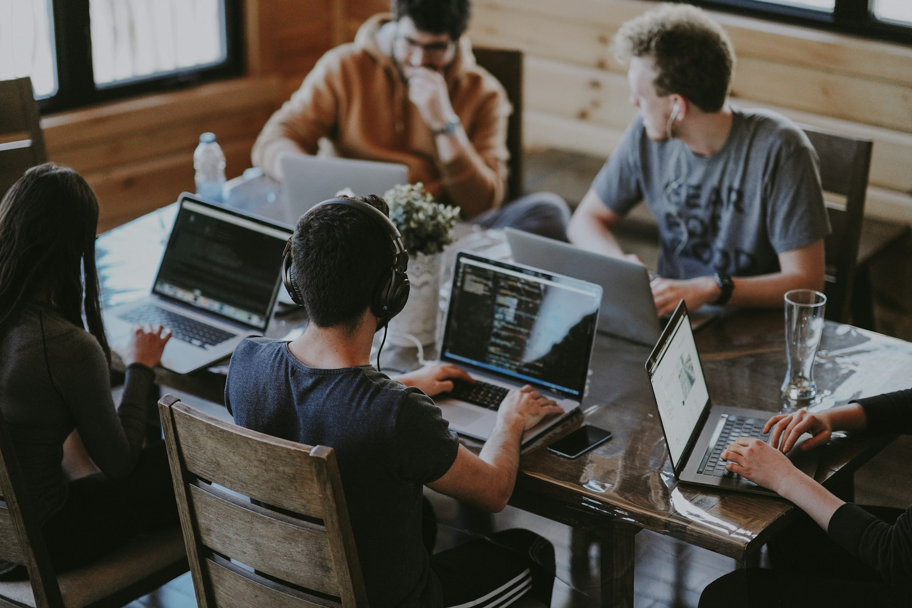 Illustrative photograph of a team collaborating around a table